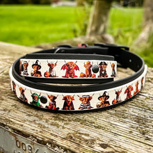 Load image into Gallery viewer, Dog collar with cartoon dog designs on a wooden surface
